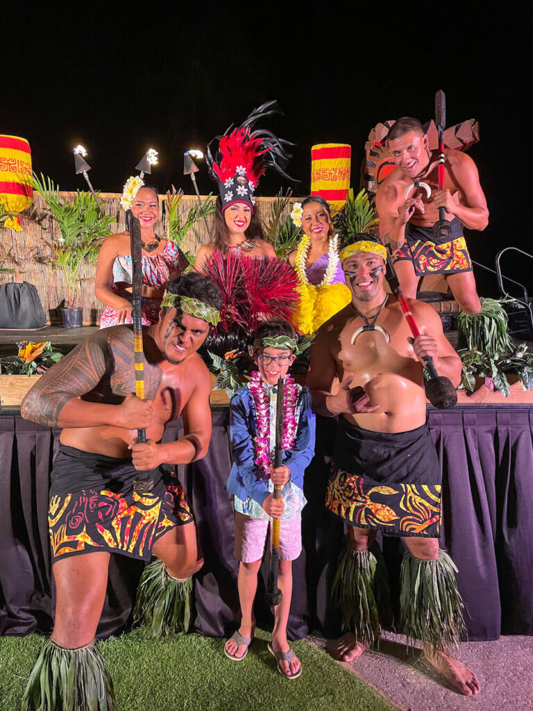 Aulii Luau on Kauai: Image of a boy surrounded by luau dancers