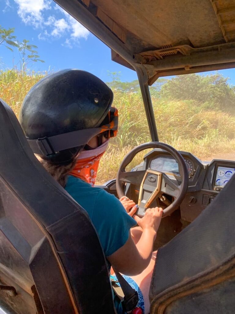 Kauai ATV Tour in Poipu: Image of a woman driving a Polaris ATV