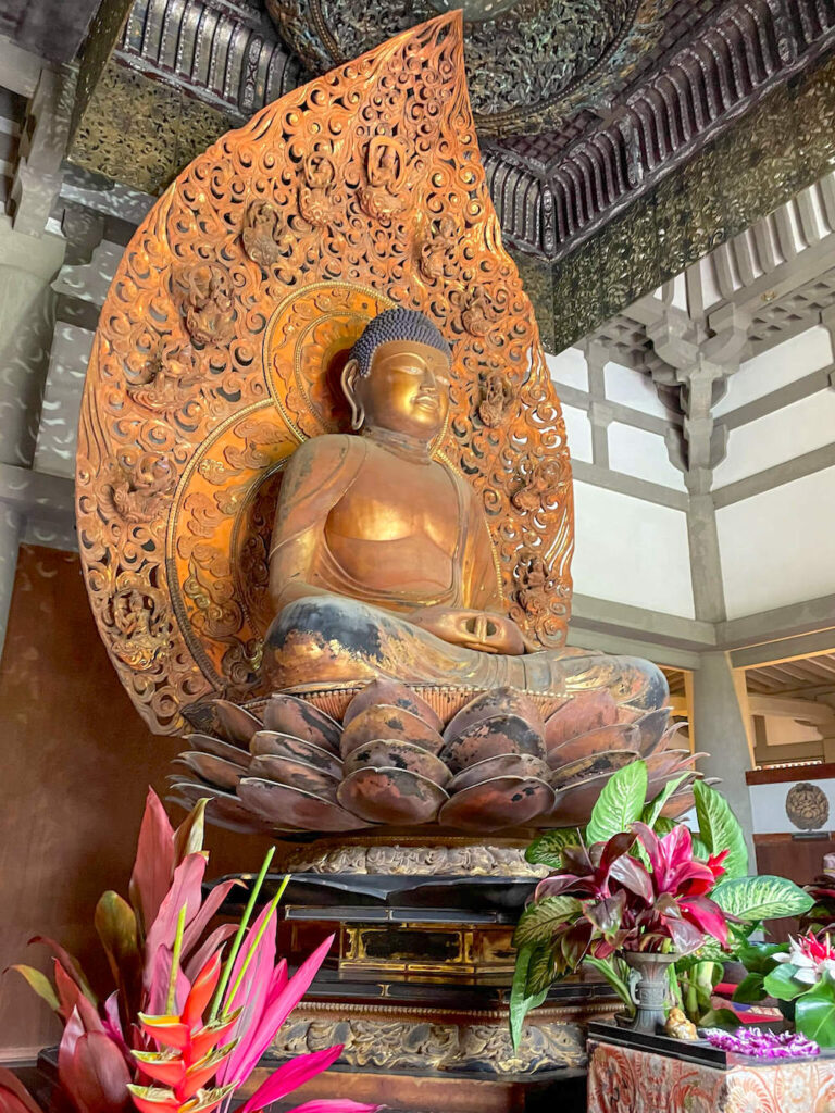 Image of a golden Buddha statue inside the Byodo-In Temple on Oahu
