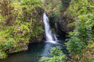Find out the best things to do in Maui in April recommended by top Hawaii blog Hawaii Travel with Kids. Image of a waterfall