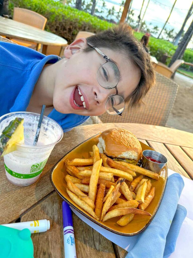 Image of a boy with a hamburger