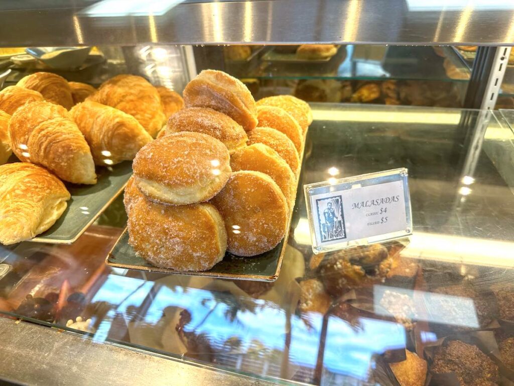 Image of malasadas in a bakery case at the Fairmont Orchid