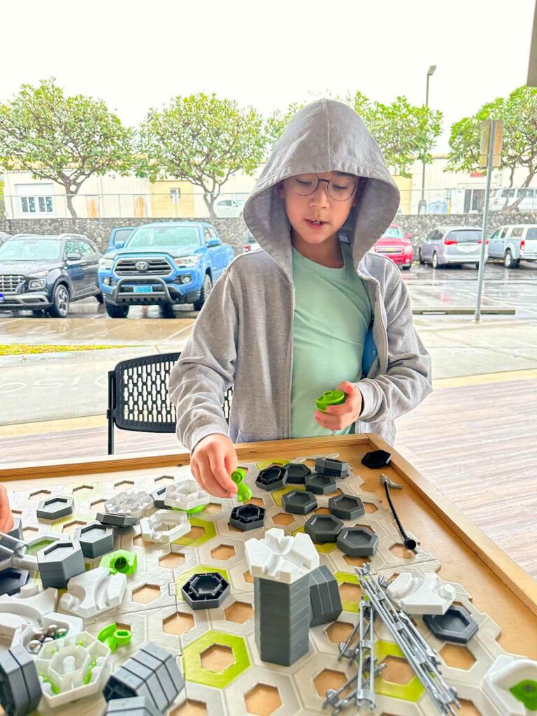 Image of a boy building a science experiment at the Hawaii Keiki Museum in Kona