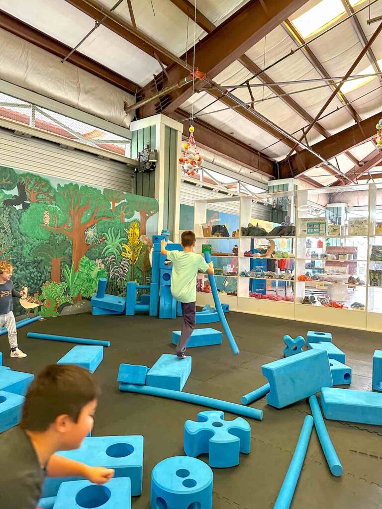 Image of a boy playing on blue foam at the Hawaii Keiki Museum in Kona