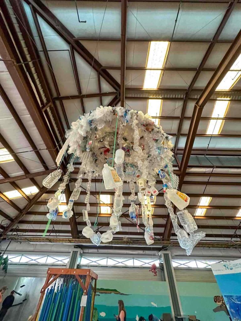 Image of a recycled plastic art piece hanging from the ceiling at the Hawaii Keiki Museum.