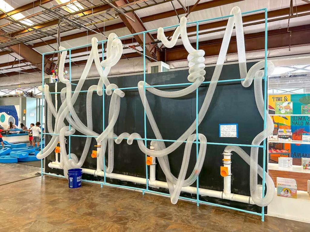 Image of a wind tunnel activity at a Hawaii children's museum.