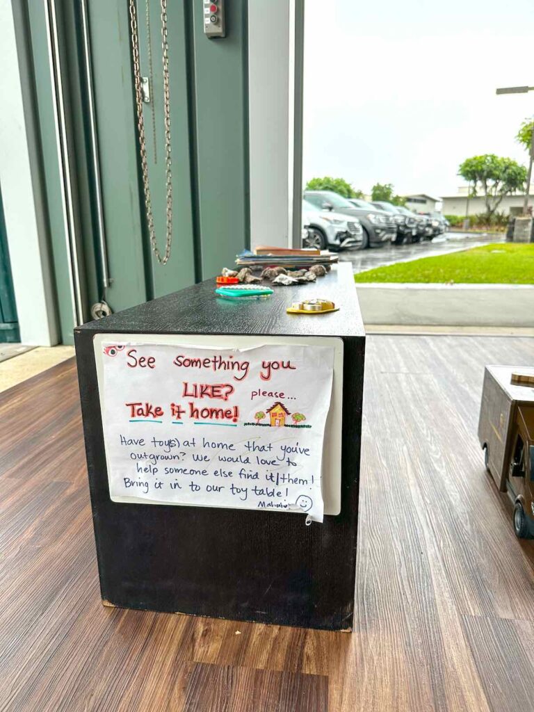 Image of a table where people can donate toys at the Hawaii Keiki Museum in Kona