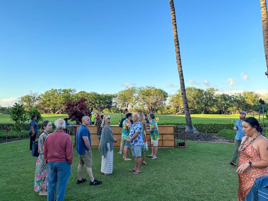 Image of people waiting in line at the bar at a Hawaii luau