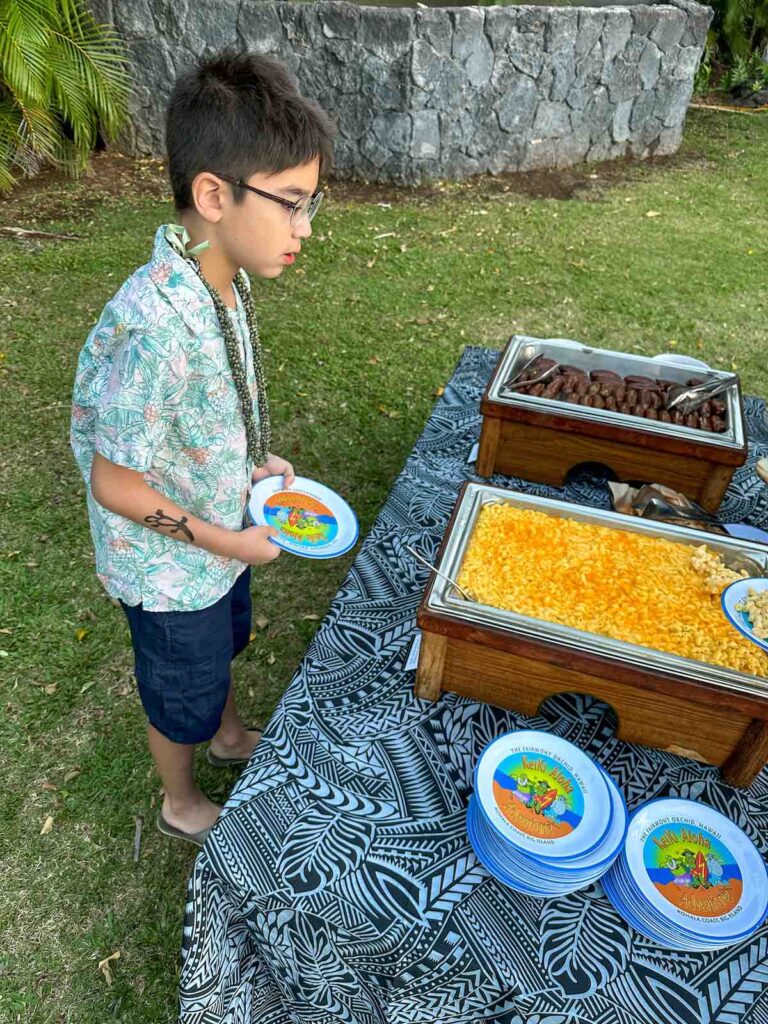 Image of a boy at a kids buffet at a luau in Hawaii