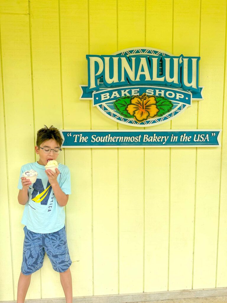 Image of a boy eating ice cream at Punalu'u Bake Shop.