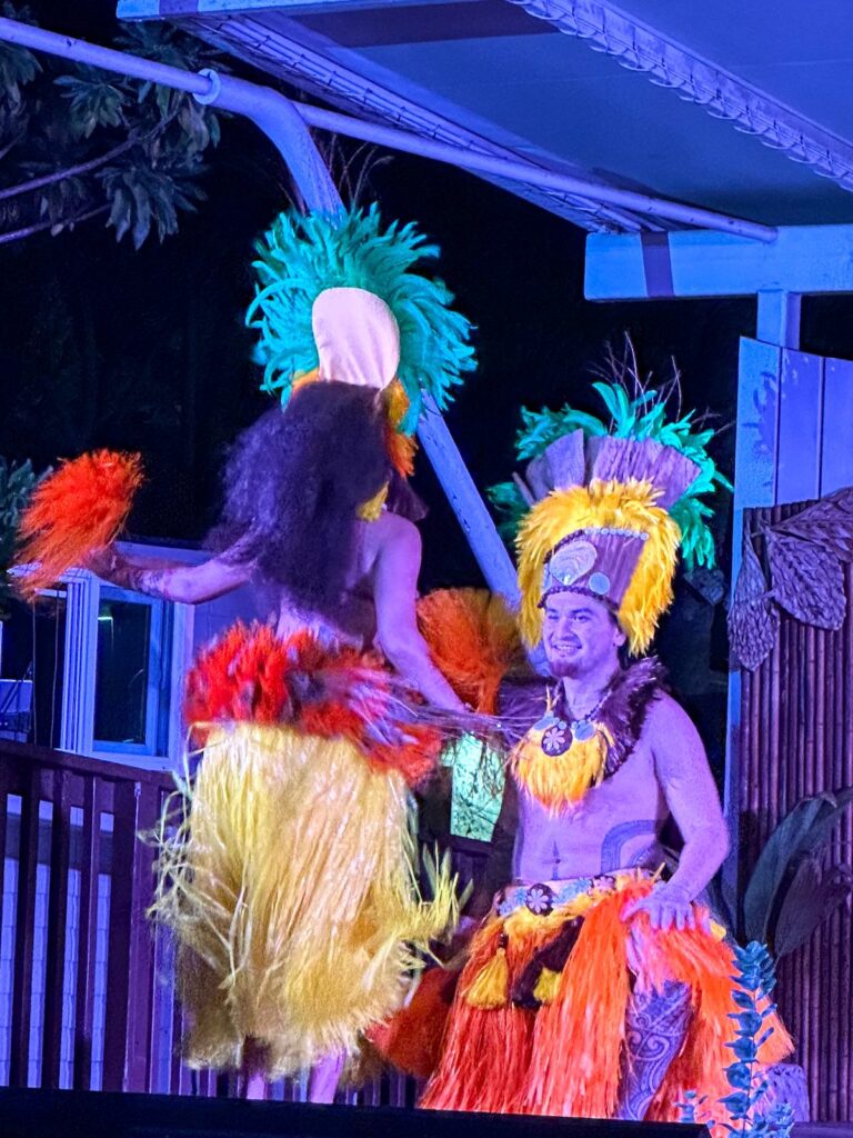 Image of a man and woman dancing Tahitian style at the Diamond Head Luau on Oahu. Photo credit: Marcie Cheung