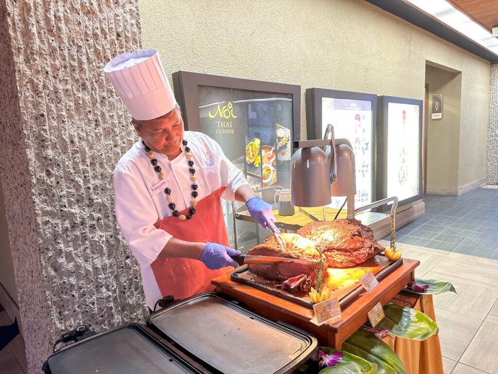 Image of a man slicing roast beef at the Rock a Hula show in Waikiki. Photo credit: Marcie Cheung