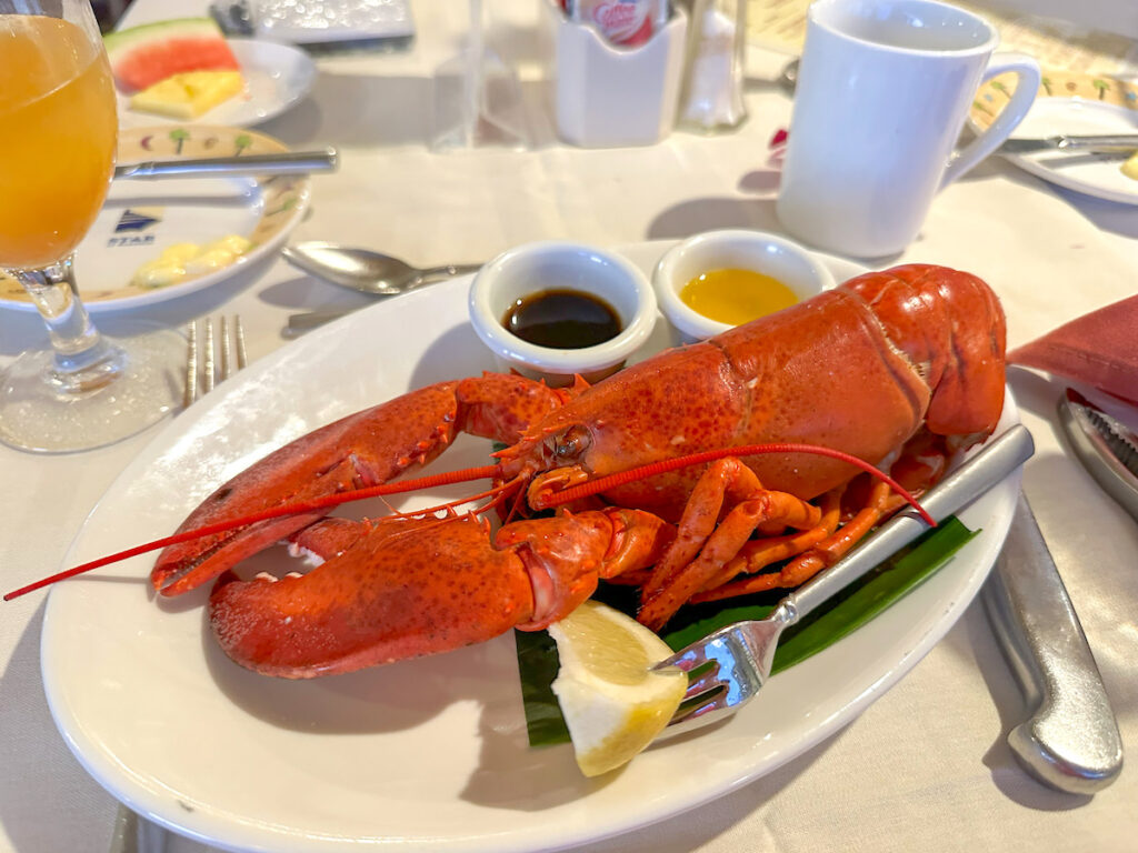 Image of cooked lobster on a plate aboard the Star of Honolulu dinner cruise in Hawaii. Photo credit: Marcie Cheung