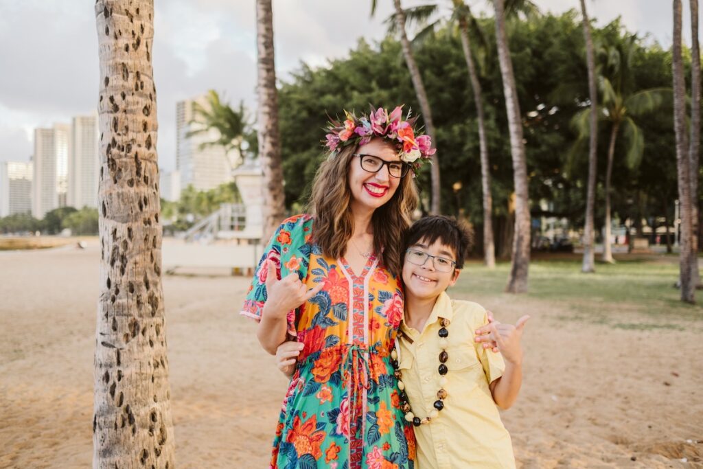 Image of Marcie Cheung of Hawaii Travel with Kids and her son in Waikiki.