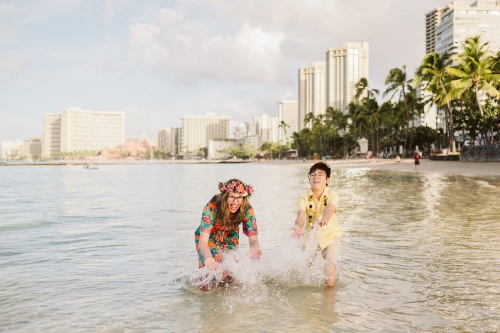 Image of Marcie Cheung of Hawaii Travel with Kids and her son in Waikiki.