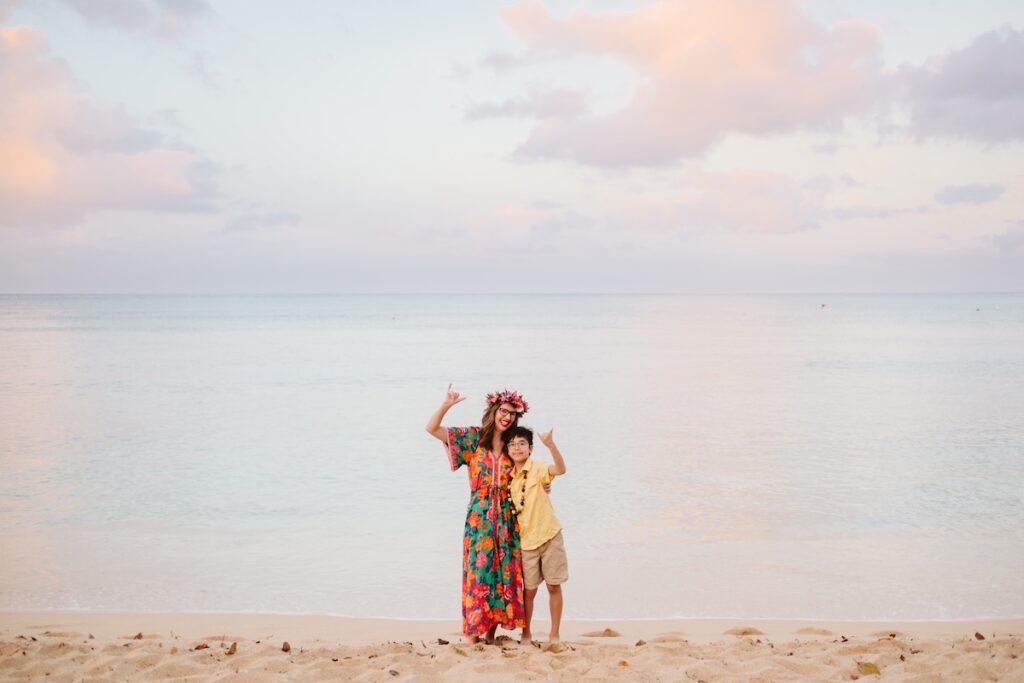 Image of Marcie Cheung of Hawaii Travel with Kids and her son in Waikiki.