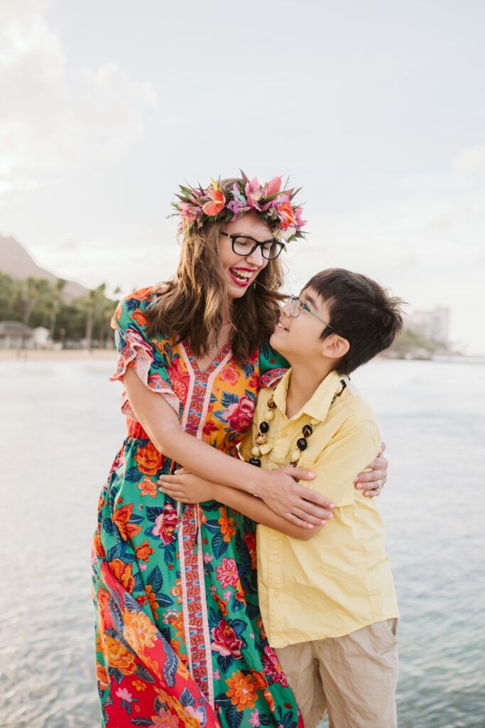 Image of Marcie Cheung of Hawaii Travel with Kids and her son in Waikiki.