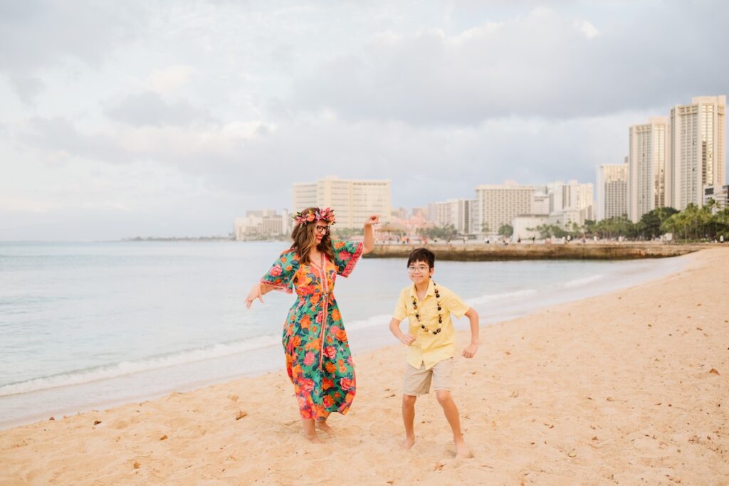 Image of Marcie Cheung of Hawaii Travel with Kids and her son in Waikiki.