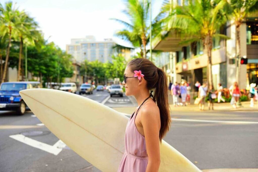 Woman-Walking-with-Surfboard-in-Waikiki-1170x781