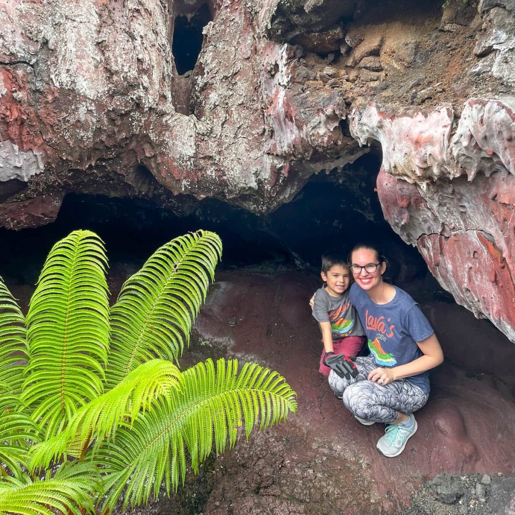 Image of Marcie Cheung and her son in a cave at Hawaii Volcanoes National Park on the Big Island