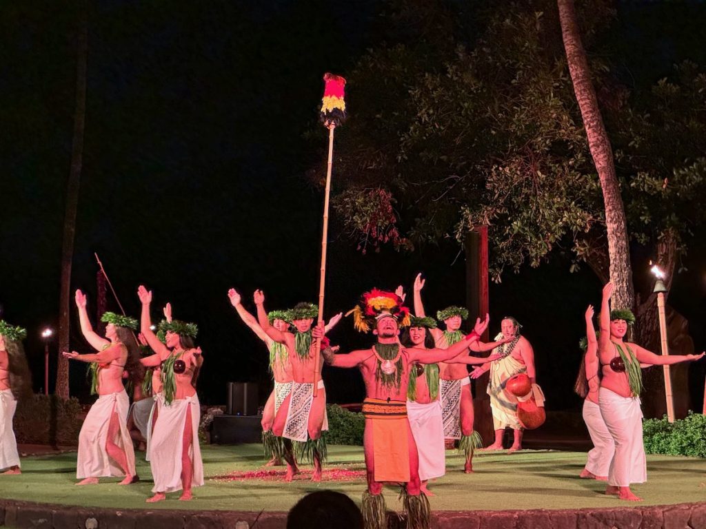 Check out this honest Old Lahaina Luau review by top Hawaii blog Hawaii Travel with Kids. Image of Hawaiian dancers on stage