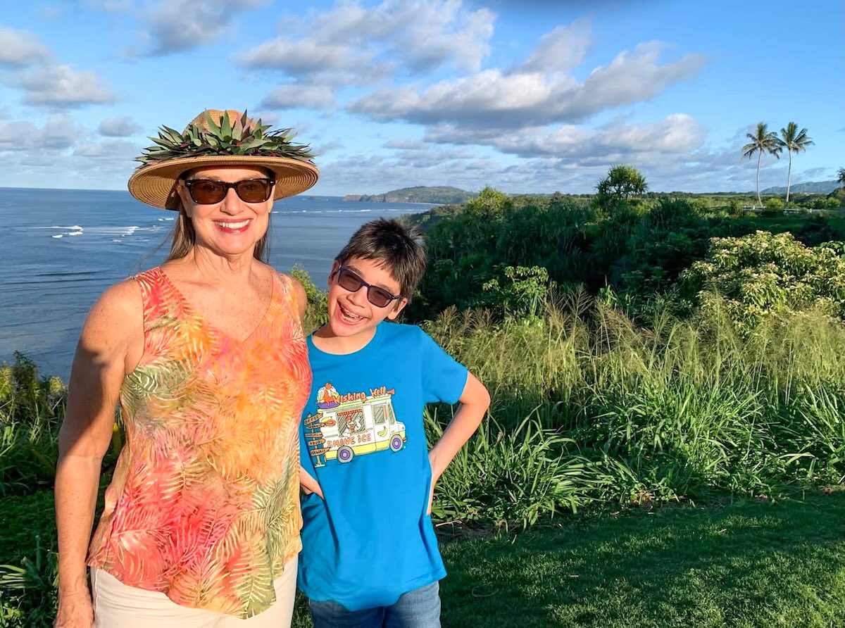 Image of a boy with his grandma on a skip generation Hawaii travel trip
