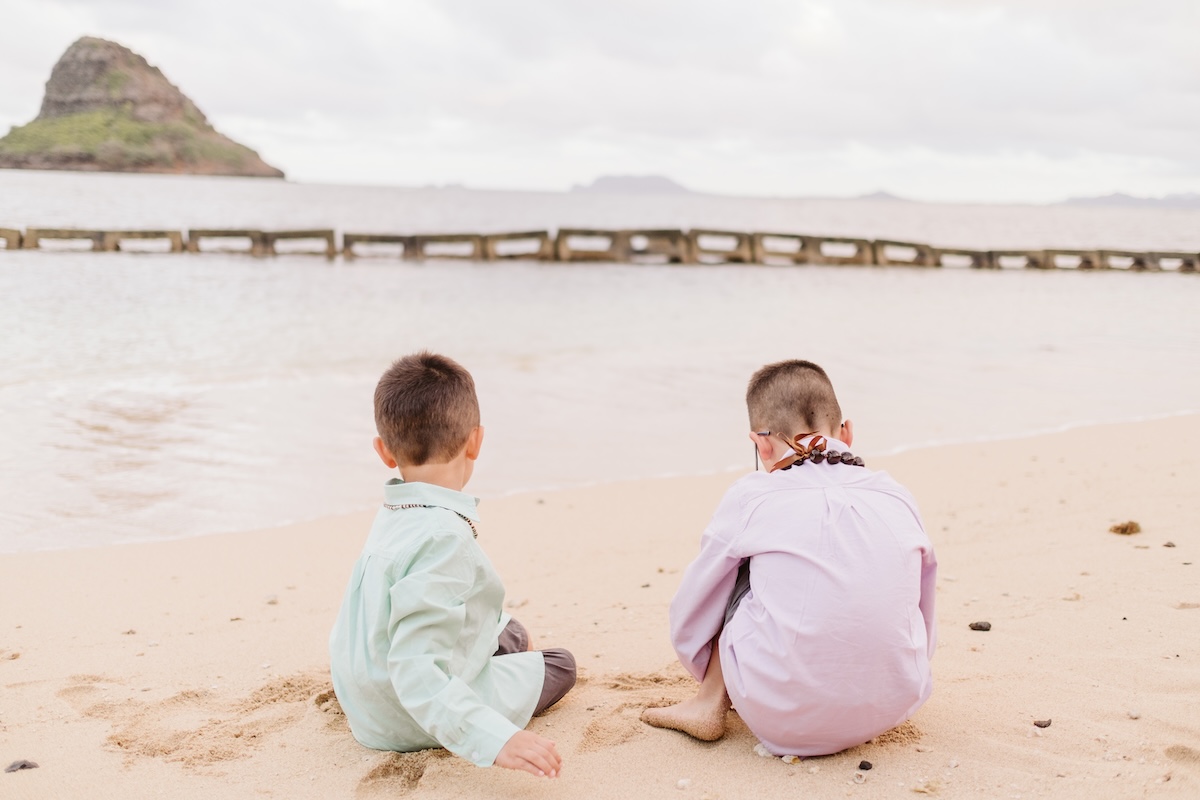 Image of two boys on a beach on Oahu.