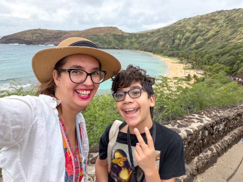 Find out how to make Hanauma Bay reservations from top Hawaii travel expert Marcie Cheung. Image of Marcie Cheung and her son at Hanauma Bay.