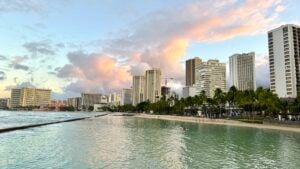 Find out what's going on with Hawaii vacation rentals in 2026. Image of Waikiki at sunrise.