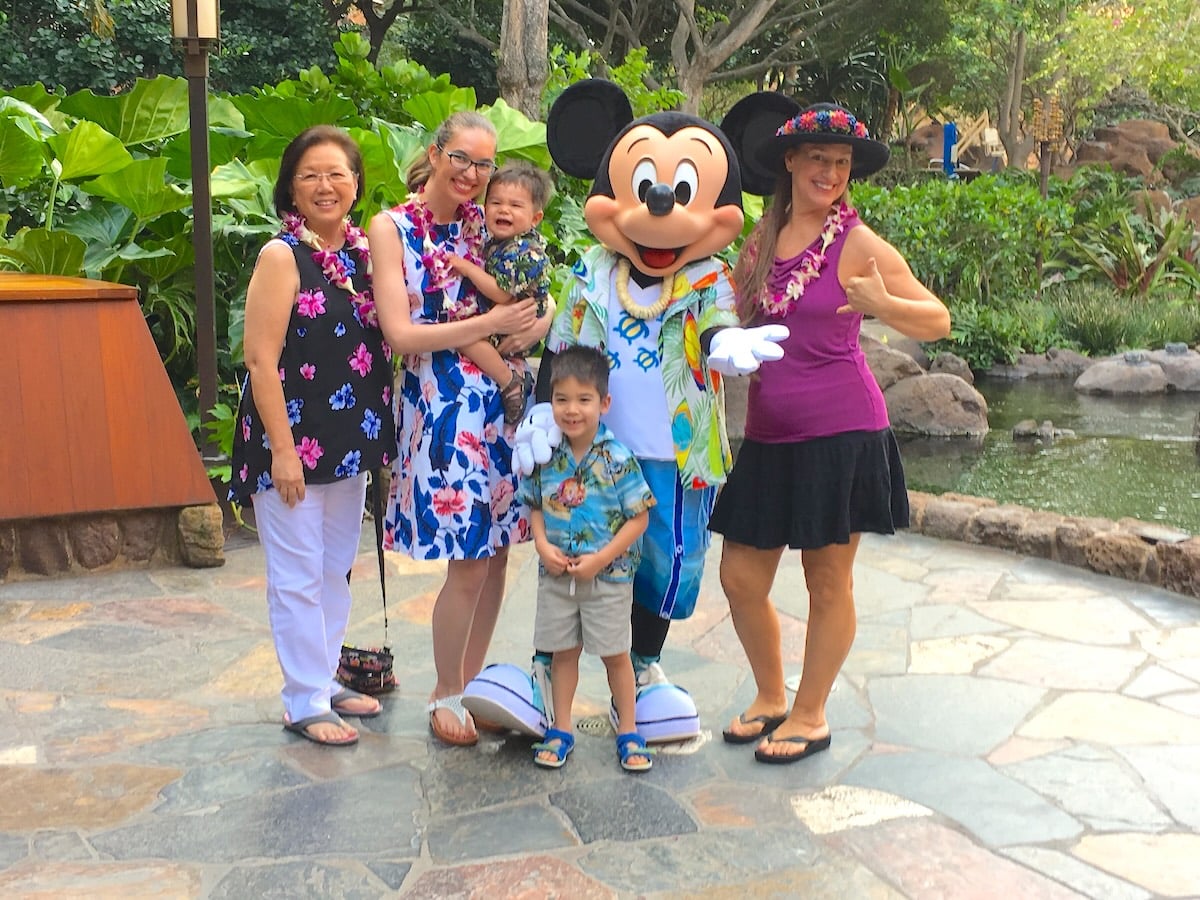 Image of Marcie Cheung and her kids, mom and MIL with Mickey Mouse at Disney Aulani
