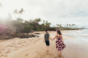 Image of Marcie Cheung and her son on a beach on Maui