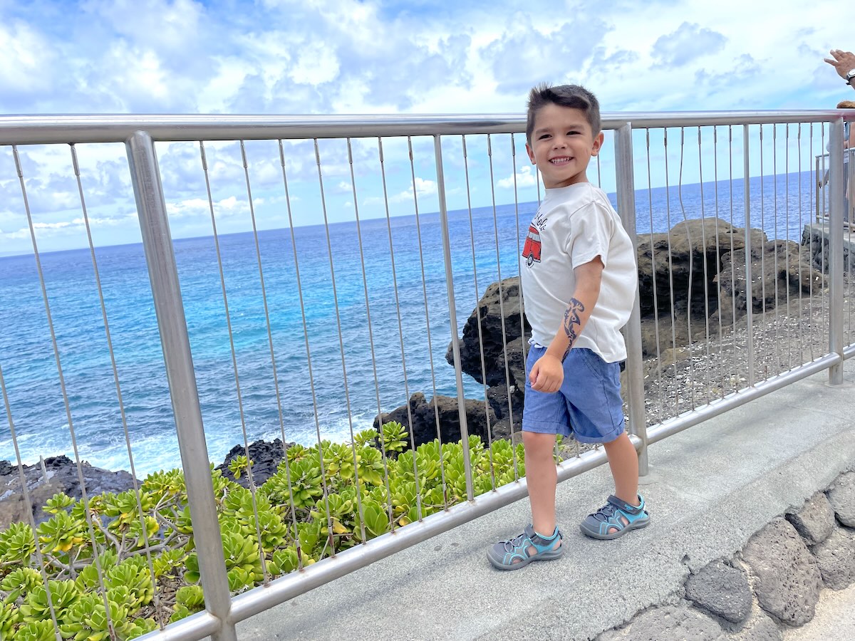 Image of a boy at the Halona Blowhole on Oahu.